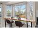 Breakfast nook featuring bar seating, backyard views, and sleek modern design, bathed in natural light at 20908 E Dorado Cir, Centennial, CO 80015
