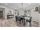 Inviting dining room with modern light fixture, a stylish table set, and lots of natural light from the window at 20908 E Dorado Cir, Centennial, CO 80015