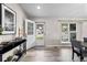 Bright entry featuring a glass paned door, wood floors, decor, and a glimpse of the neighborhood at 20908 E Dorado Cir, Centennial, CO 80015