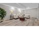 Bright living room with hardwood floors and comfortable seating arrangement at 20908 E Dorado Cir, Centennial, CO 80015