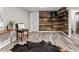 This area features a rustic wood accent wall, sleek flooring, and minimalist decor, creating a modern and inviting space at 20908 E Dorado Cir, Centennial, CO 80015