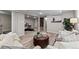 Bright and airy living room with hardwood floors, neutral furniture, and a stylish accent rug creating a welcoming space at 20908 E Dorado Cir, Centennial, CO 80015