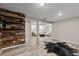 Open-concept living space with hardwood floors, wood accents, and modern furnishings at 20908 E Dorado Cir, Centennial, CO 80015