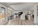 Spacious living area showcasing an open layout, connecting the kitchen to the staircase at 20908 E Dorado Cir, Centennial, CO 80015