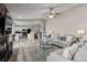 Open-concept living area connecting a stone fireplace, comfortable seating, and a full kitchen at 20908 E Dorado Cir, Centennial, CO 80015