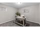 Neutral office featuring a simple desk, chair, carpeted floor and a sunny window at 20908 E Dorado Cir, Centennial, CO 80015