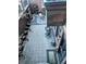 Overhead shot of a brick patio complete with a bistro set and assorted potted plants at 1674 Fillmore St # Al3, Denver, CO 80206