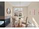 Cozy dining area with a fireplace, round table, and natural light at 1674 Fillmore St # Al3, Denver, CO 80206