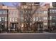 Attractive brick townhomes with well-manicured landscaping and secure black metal fencing at 1674 Fillmore St # Al3, Denver, CO 80206