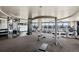 Well-equipped gym featuring treadmills and weight machines with city views at 1674 Fillmore St # Al3, Denver, CO 80206