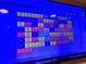 Electronic information screen with package updates and weather information in a residential building at 1674 Fillmore St # Al3, Denver, CO 80206