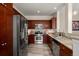 Modern kitchen features stainless steel appliances, granite countertops, and ample cabinet space at 1674 Fillmore St # Al3, Denver, CO 80206