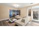Cozy living room features an L-shaped sofa, modern art, and natural light at 1674 Fillmore St # Al3, Denver, CO 80206