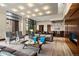 Elegant lounge featuring a fireplace, piano, and comfortable seating with large windows at 1674 Fillmore St # Al3, Denver, CO 80206