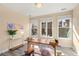 Bright office space features a large desk, stylish decor, and natural light at 1674 Fillmore St # Al3, Denver, CO 80206