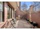 Private patio featuring brick walls, a built-in grill, and outdoor seating at 1674 Fillmore St # Al3, Denver, CO 80206