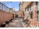 Charming outdoor patio area with brick accents and comfortable seating at 1674 Fillmore St # Al3, Denver, CO 80206