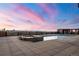 Rooftop pool with stunning city and mountain views at sunset in a luxury building at 1674 Fillmore St # Al3, Denver, CO 80206