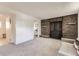 Cozy finished basement featuring a brick fireplace and neutral carpeting at 9958 Milwaukee St, Thornton, CO 80229