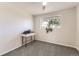 Bright bedroom with light walls, gray carpeting, and ample natural light from the window at 9958 Milwaukee St, Thornton, CO 80229