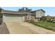 Attractive home with a two-car garage, brick and siding exterior, and a well-kept lawn and driveway at 9958 Milwaukee St, Thornton, CO 80229