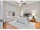 Inviting bedroom with a ceiling fan, large window, and hardwood floors creating a comfortable retreat at 40 Madison St # 103, Denver, CO 80206