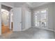 Spacious room featuring a large window, closet, and glass paneled doors, perfect for an office or bedroom at 40 Madison St # 103, Denver, CO 80206