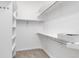 Well-organized walk-in closet with adjustable shelving, providing ample storage space for clothing and accessories at 40 Madison St # 103, Denver, CO 80206