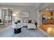Cozy living room with stylish furniture, area rug and an open doorway to another room at 40 Madison St # 103, Denver, CO 80206