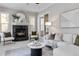 Inviting living room featuring a cozy fireplace, stylish seating, and ample natural light at 40 Madison St # 103, Denver, CO 80206