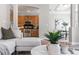 Comfortable living room showcasing a view of the kitchen with stainless steel appliances and dining area at 40 Madison St # 103, Denver, CO 80206