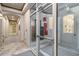 Lobby area featuring tile floors, access to mailboxes, and doors to exterior at 40 Madison St # 103, Denver, CO 80206