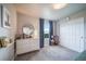 Bright bedroom features neutral walls, carpet, storage, and a window with nice natural light at 476 Hyde Park Cir, Castle Pines, CO 80108