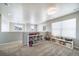 Carpeted bonus room with built-in storage and abundant natural light at 476 Hyde Park Cir, Castle Pines, CO 80108