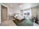Bright main bedroom with carpet flooring, rocking chair, and plenty of natural light at 476 Hyde Park Cir, Castle Pines, CO 80108