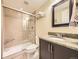 Modern bathroom featuring a glass-enclosed shower and a granite vanity at 7782 S Louthan St, Littleton, CO 80120