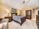 Spacious bedroom featuring natural light, bedside tables, and an armoire for comfortable living at 7782 S Louthan St, Littleton, CO 80120