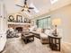 Bright living room with vaulted ceilings, skylights, a cozy fireplace and large windows for ample natural light at 7782 S Louthan St, Littleton, CO 80120
