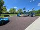 Vibrant playground featuring blue climbing structures, slides, and play equipment for  at 7782 S Louthan St, Littleton, CO 80120