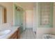 Bathroom with vintage fixtures and a separate shower area at 2245 Julian St, Denver, CO 80211