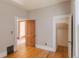 Bedroom featuring hardwood floors, neutral paint, and traditional trim at 2245 Julian St, Denver, CO 80211