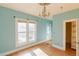 Bedroom featuring large windows, wood floors, and natural light at 2245 Julian St, Denver, CO 80211