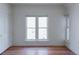 Bright bedroom with multiple windows and hardwood floors at 2245 Julian St, Denver, CO 80211