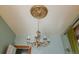 Ornate chandelier with crystal pendants and decorative ceiling medallion at 2245 Julian St, Denver, CO 80211