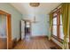 Charming dining room with hardwood floors, vintage chandelier, and ample natural light at 2245 Julian St, Denver, CO 80211