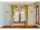 Dining room featuring original hardwood floors, period lighting, and decorative window trim at 2245 Julian St, Denver, CO 80211