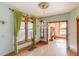 Bright dining room with chandelier lighting, natural light, and hardwood floors at 2245 Julian St, Denver, CO 80211