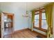 Bright dining area featuring hardwood floors, chandelier, and view into adjacent kitchen at 2245 Julian St, Denver, CO 80211