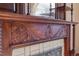 Ornate fireplace with decorative wood carvings and tiled surround at 2245 Julian St, Denver, CO 80211