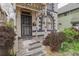 Inviting front entrance with a decorative security door and classic architectural elements at 2245 Julian St, Denver, CO 80211